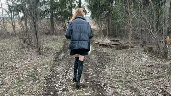 A Slender Long-Legged Girl Walks In High Boots With High Heels Through Puddles And Mud, Gets Stuck In The Mud, Her Boots Fill With Water